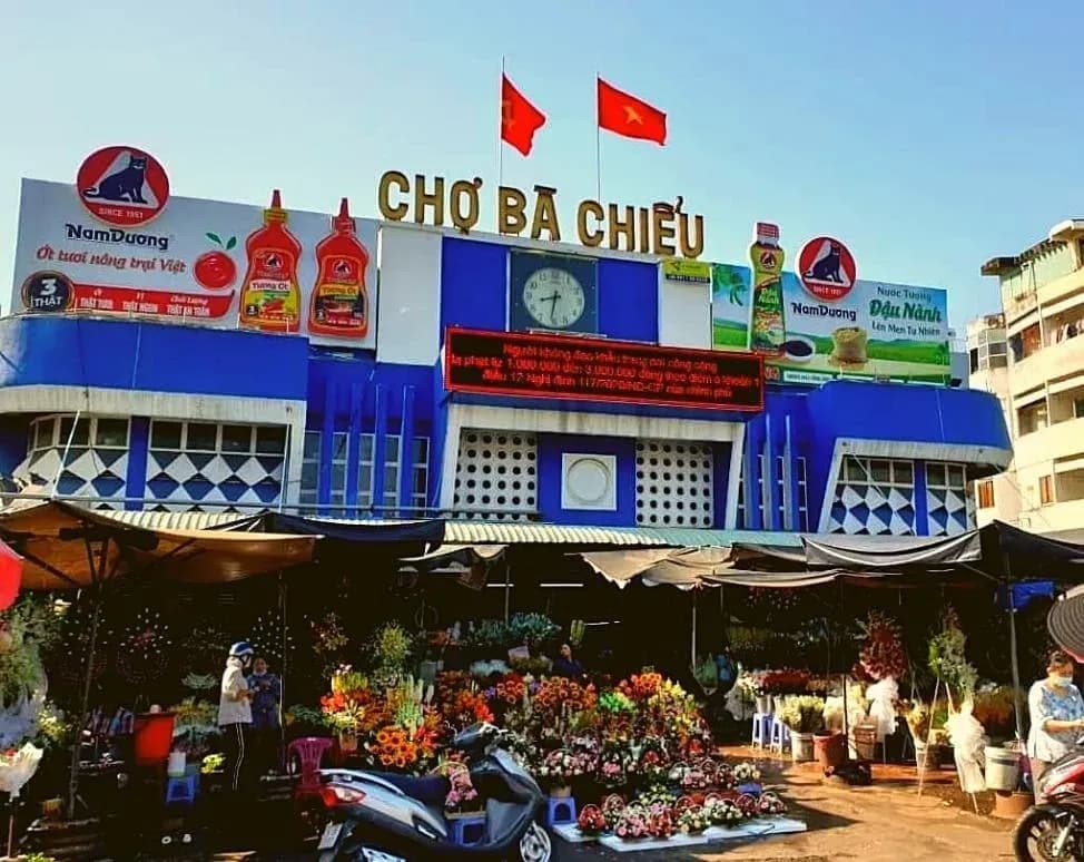 Ba Chieu Market in Saigon stands out with its unique blue entrance and prominent signage.