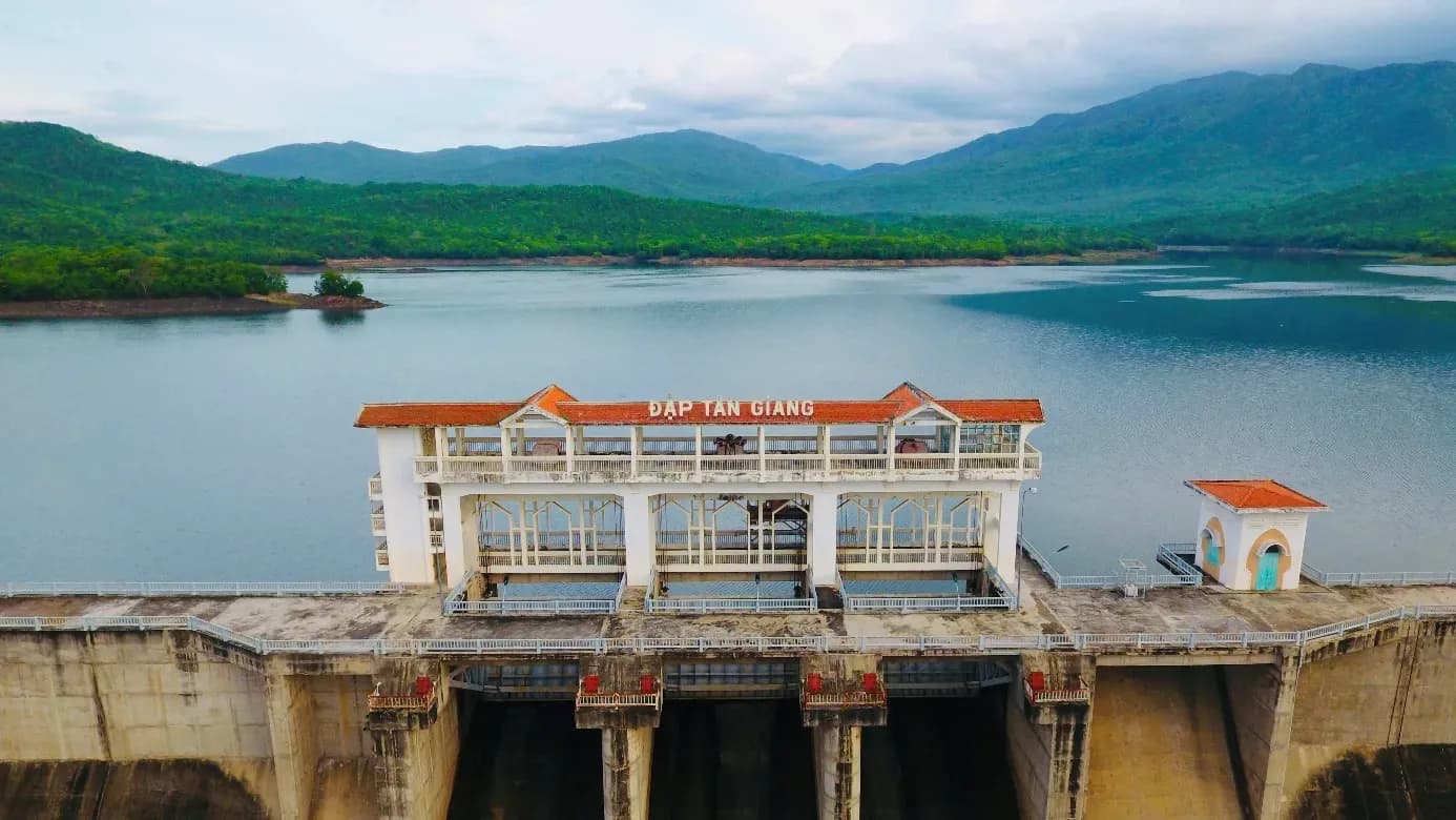 Discover the architectural beauty of Tan Giang Dam amidst majestic nature.