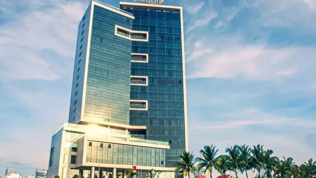 The Nalod Hotel stands majestically with its luxurious architecture against the blue sky.