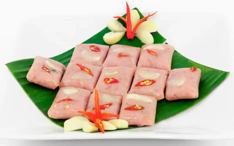 Nem Cho Huyen on banana leaf with chili and garlic