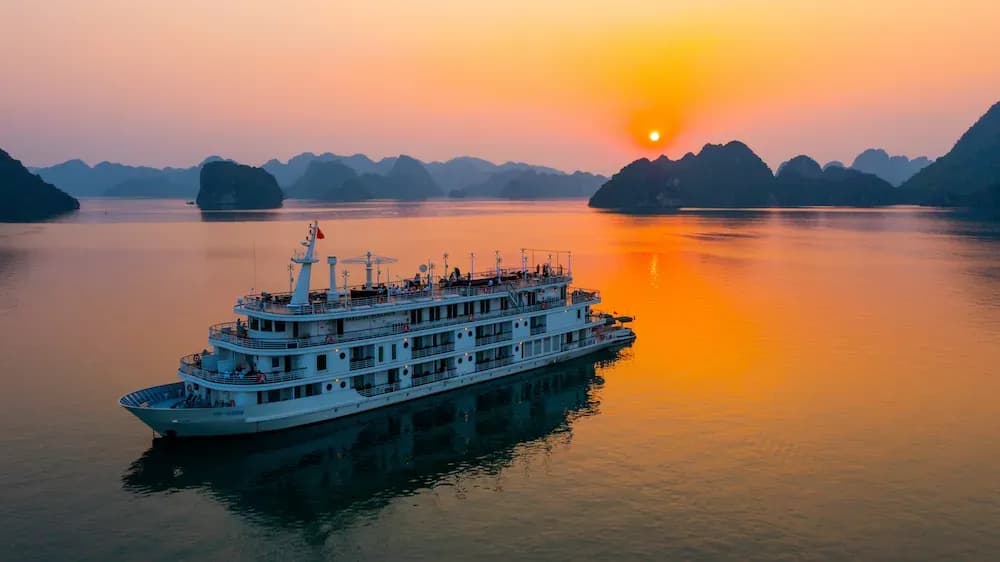 The luxurious Paradise Elegance cruise on Ha Long Bay at sunset.
